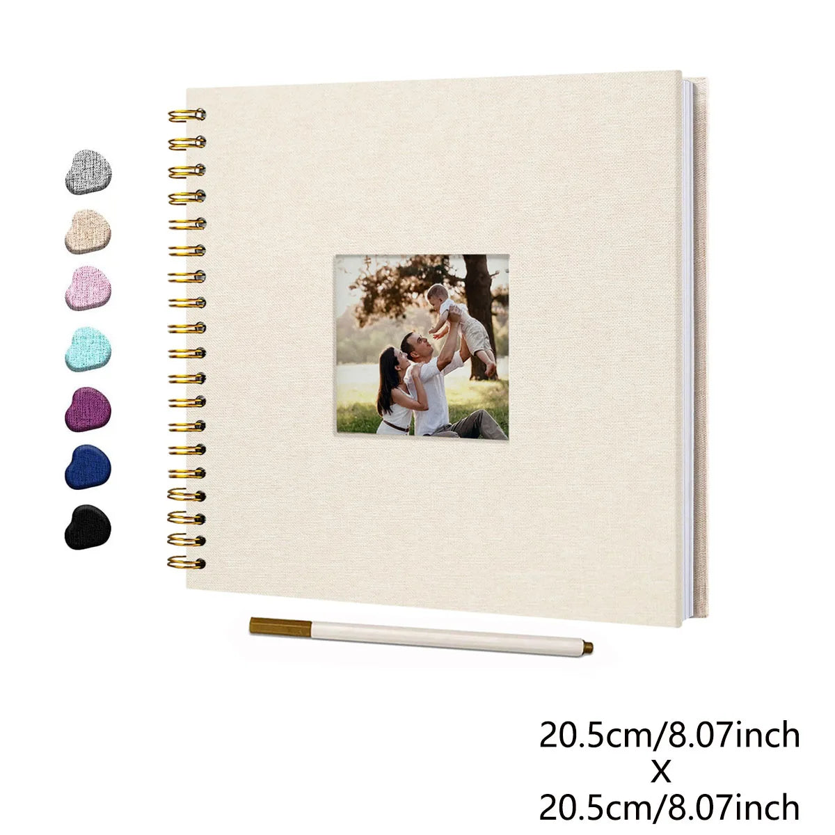 A beige linen cover scrapbook album with a spiral binding and a photo insert, next to a gold pen.
