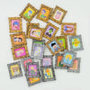 A collection of miniature framed wall art featuring colorful illustrations for dollhouse decor
