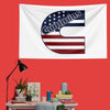A white flag featuring the Cummins logo in navy blue and red stripes on a red wall.