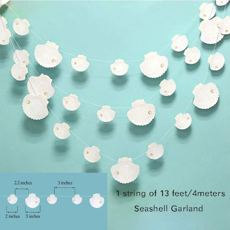 A string of iridescent seashell garland with small white shells draped across a light blue background.