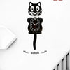 A black cartoon cat wall clock with a swinging tail, showing the time.