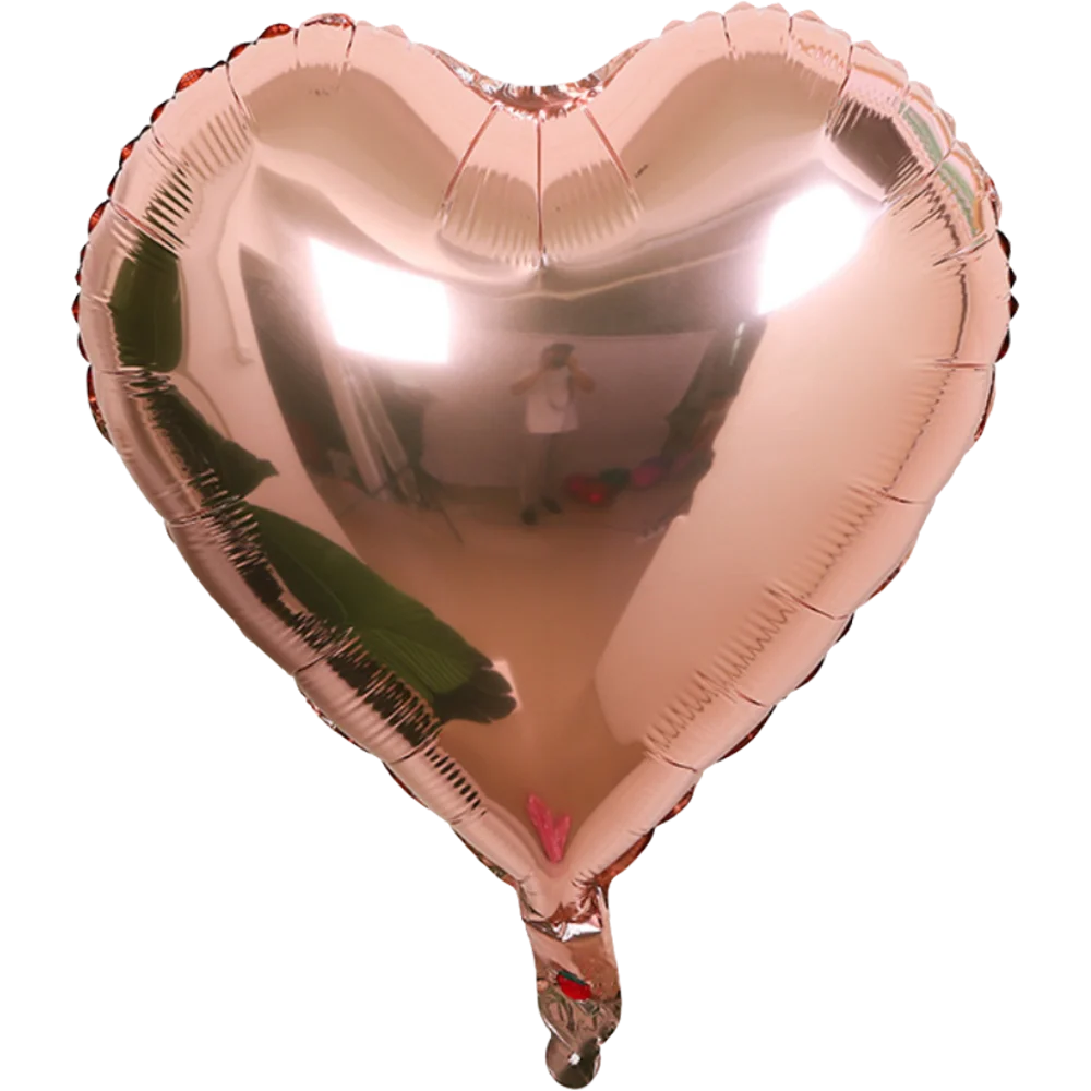 A heart-shaped foil balloon featuring a star design, reflecting an interior room.