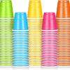 A stack of colorful disposable plastic shot cups in various shades of green, yellow, blue, and pink.