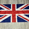 A folded United Kingdom national flag displaying the Union Jack design.