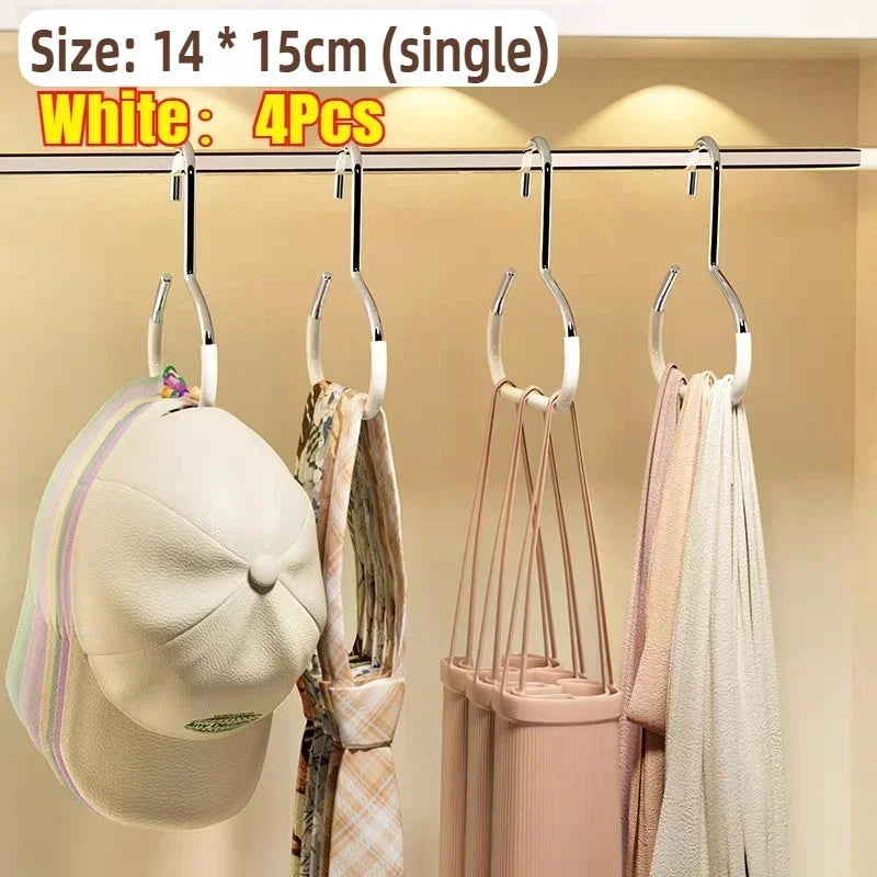 White round multi-purpose closet hooks displaying four pieces of clothing and a hat on a clothes rack