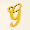 A bright yellow 3D acrylic letter G wall sticker against a plain background.