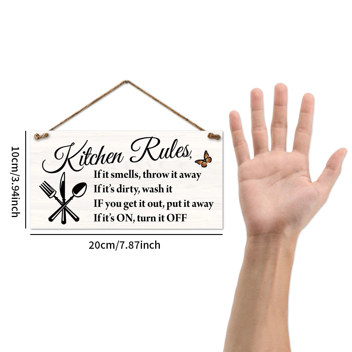 A wooden kitchen rules sign with instructions for cleaning and usage, hanging by twine.