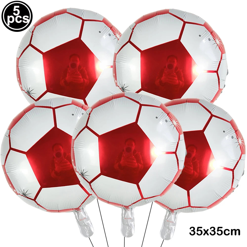 Five white inflatable soccer balls used as party decor