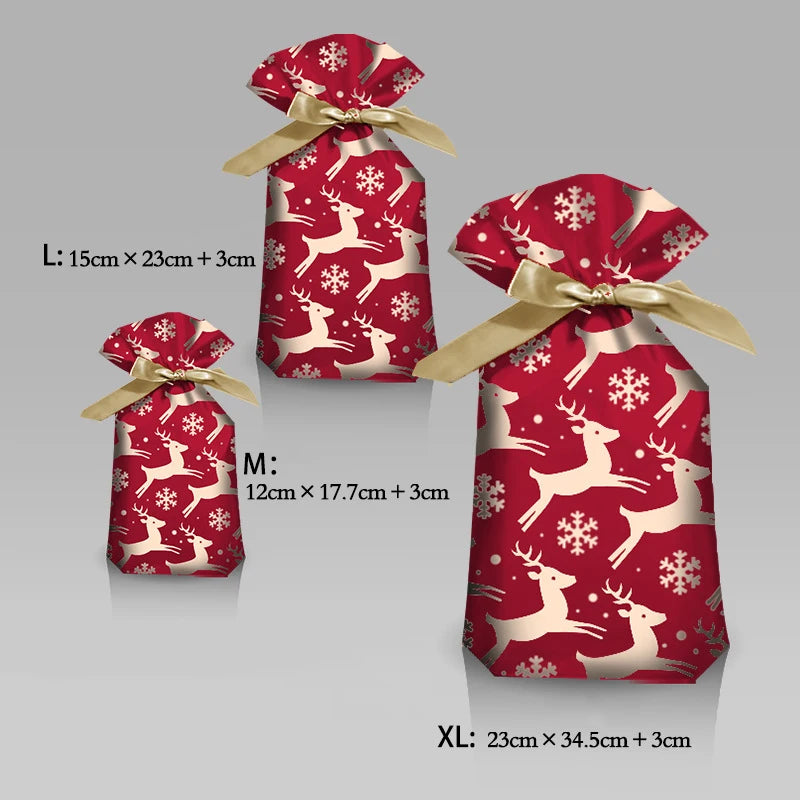 Three drawstring gift bags in red featuring white reindeer and snowflake designs, labeled L, M, and XL.