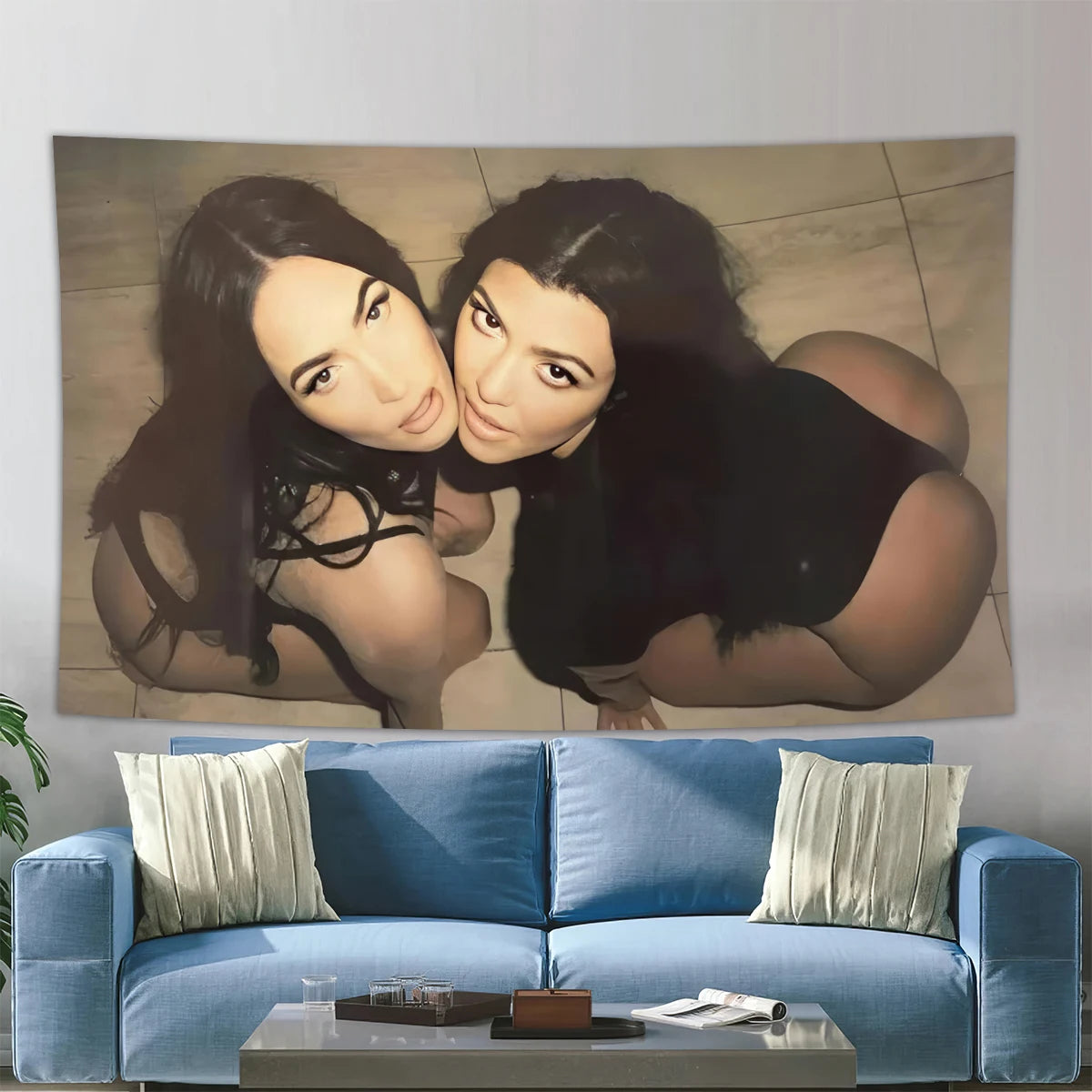 A portrait of Megan Fox in a black top leaning her head on another woman's shoulder, displayed as wall art.