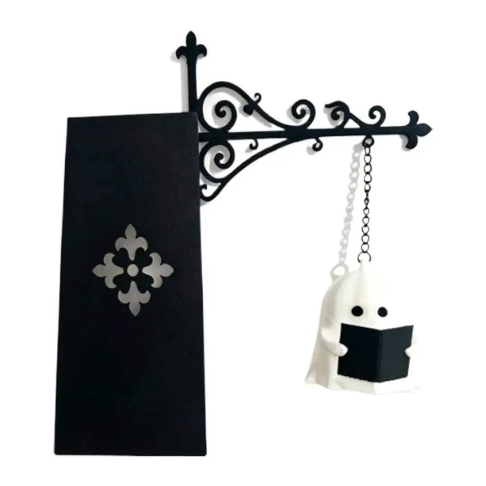Black wrought iron book nook lamp featuring a white ghost design.