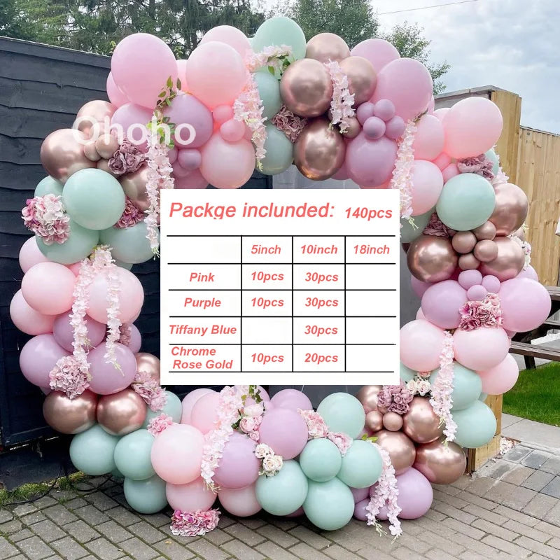 A balloon garland kit featuring pink, purple, and rose gold balloons arranged in an archway.