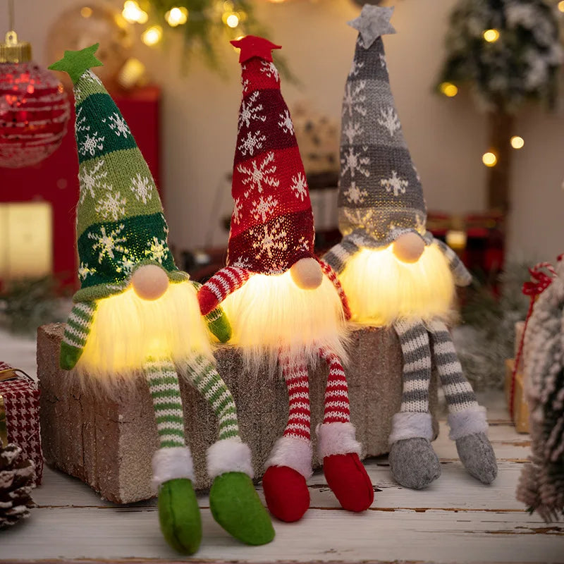 A festive display of illuminated LED gnome decorations with warm glow and fuzzy accents for holiday displays.