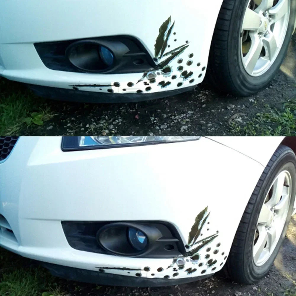 A white car's front bumper features a black and white splatter decal design.