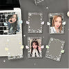 Clear acrylic photocard holders featuring stars and angel wings, displayed on a gray background.