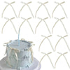 A set of twenty white bowknot ribbon cake toppers displayed around a light blue cake.