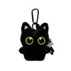 A black seal plush keychain with gold-yellow eyes and a metal loop.