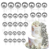 A set of silver spherical foam cake toppers for decoration.