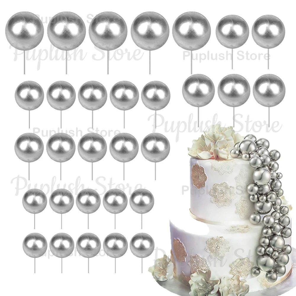 A set of silver spherical foam cake toppers for decoration.