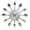 A silver modern cutlery set arranged like a clock with forks radiating from the center.