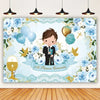 A light blue and white floral backdrop for a First Communion featuring balloons and gold accents.