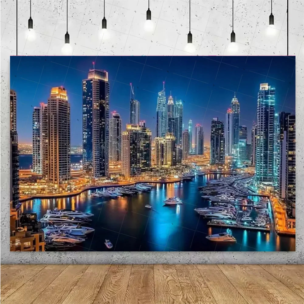 A photograph of a vibrant night city skyline featuring numerous high-rise buildings reflected in water.