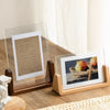 A walnut wood and acrylic photo frame displaying a photograph of apples on a rustic wreath.