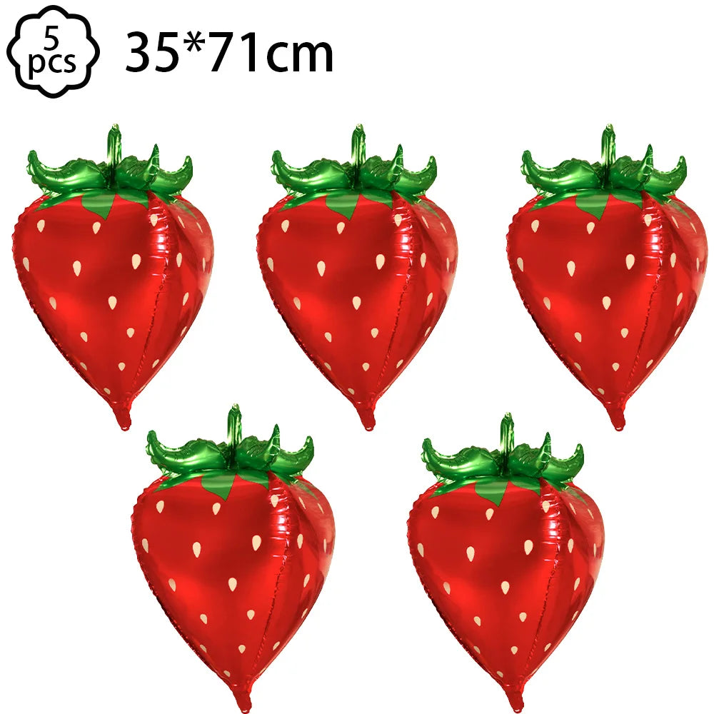 A set of five artificial strawberries used for party decorations