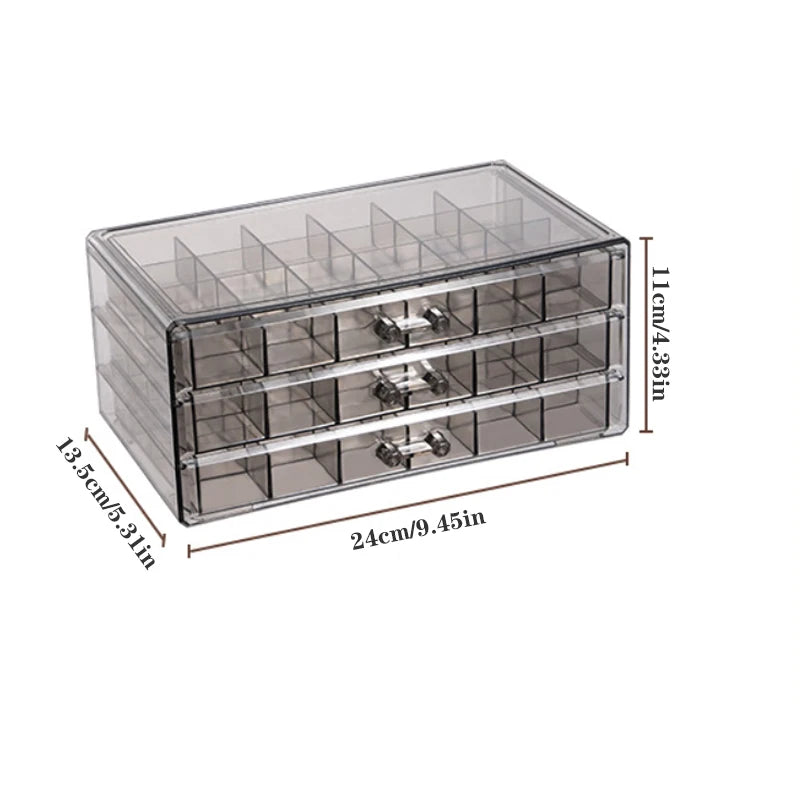 Clear acrylic jewelry organizer with three drawers, measuring 11cm high and 24cm long.