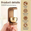 A hand holds a wooden doorbell with a brass bell, showcasing its design and materials.