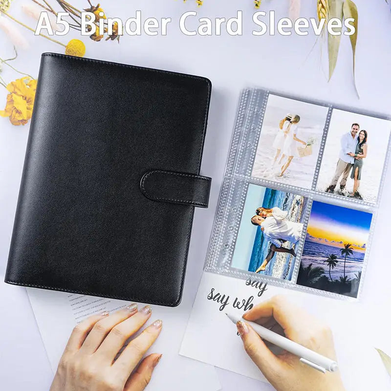 A black A5 PU leather binder sleeve with decorative card sleeves and a hand writing on paper.