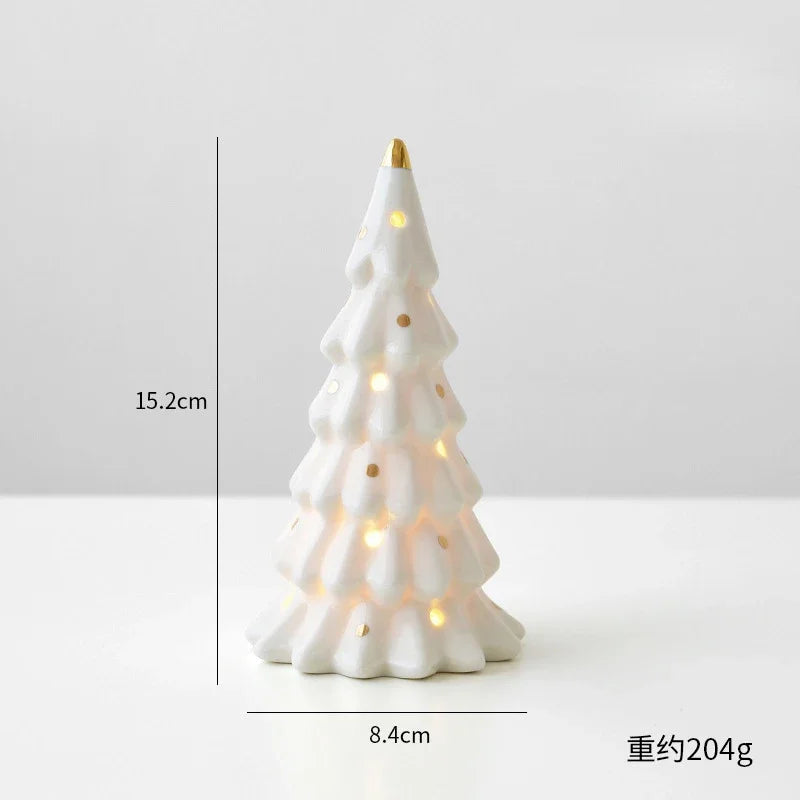A white ceramic glow-in-the-dark mini Christmas tree decor with warm lights.