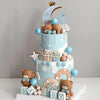 A tiered blue cake decorated with teddy bears, stars, clouds, and blue balls for a baby shower.