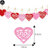 A string of eight heart-shaped letter balloons in red and pink foil finishes.