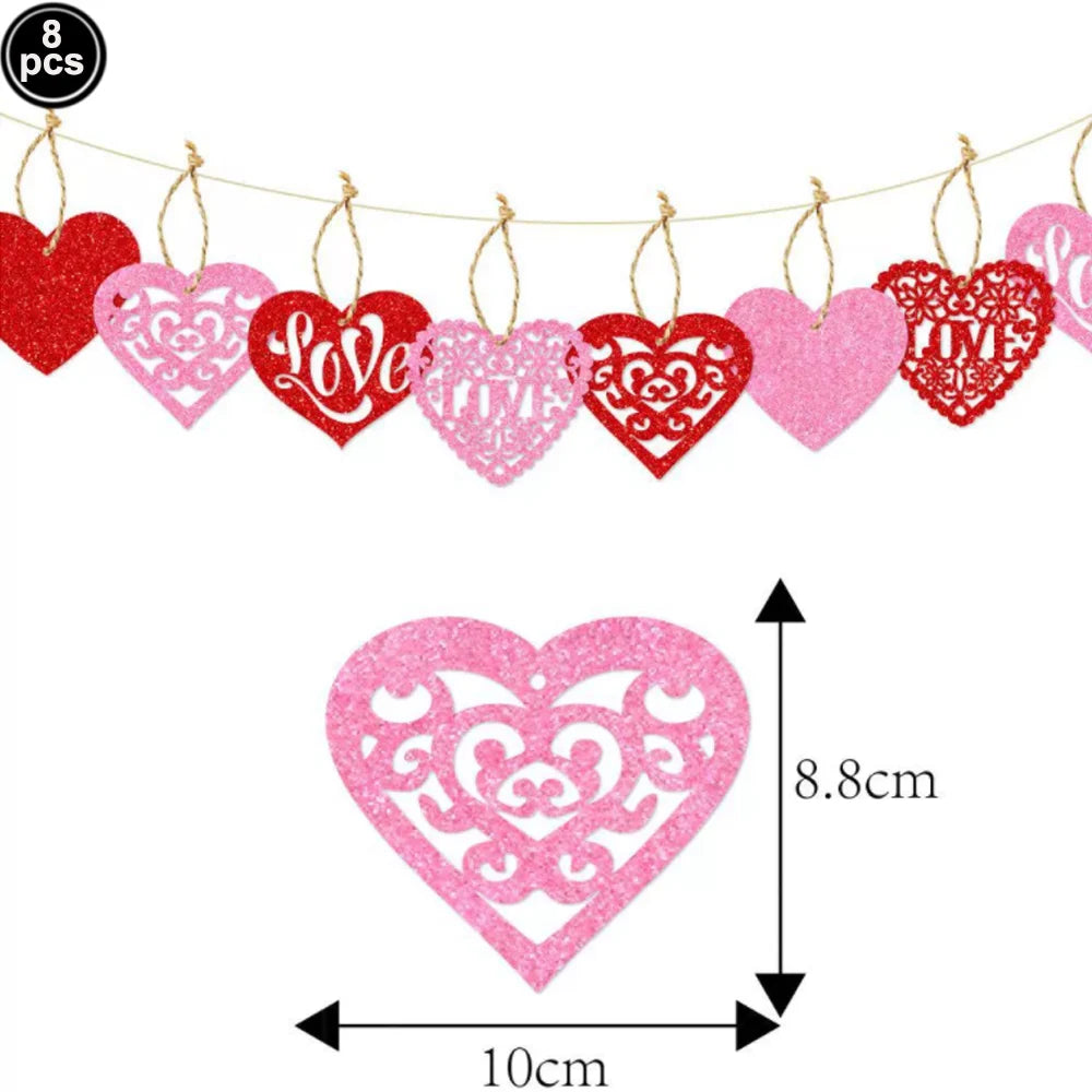 A string of eight heart-shaped letter balloons in red and pink foil finishes.