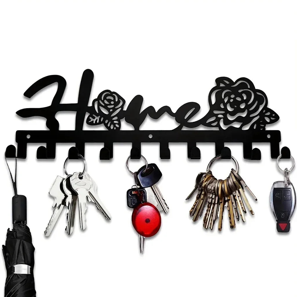 Decorative metal wall-mounted key holder featuring seven hooks for keys and accessories