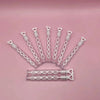 A collection of heart-shaped clear bubble wands arranged in a fan shape on a pink background.