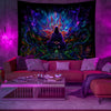 A vibrant, glowing tapestry featuring an intense purple and blue psychedelic alien design displayed on a wall.