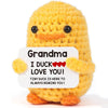 Handmade yellow knitted duck plush toy with an inspirational card that says I duck love you