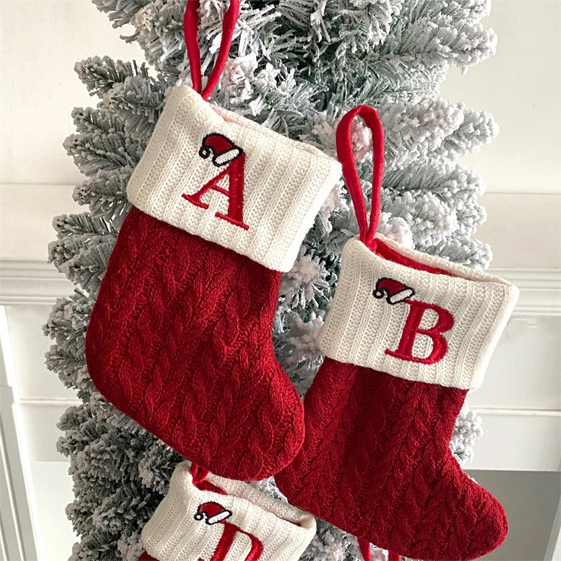 Red and white knitted alphabet socks shaped like A and B for Christmas tree ornaments