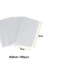 A stack of 100 clear cellophane treat bags with wire ties, showing a 6cm by 9cm size.