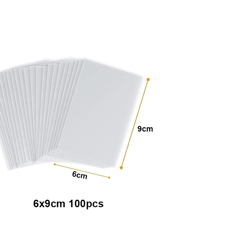A stack of 100 clear cellophane treat bags with wire ties, showing a 6cm by 9cm size.