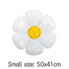 A cluster of white and yellow foil balloons arranged in a flower shape.