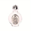 A clear glass bottle with a silver cap containing a religious sculpture of a saint.