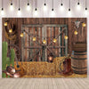 A rustic western backdrop featuring a wooden barn door, hay, leather boots, and various cowboy accessories.