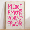 A framed canvas print featuring the pink text MORE AMOR POR FAVOR on a light background.