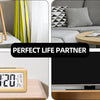 A solid wood digital alarm clock with calendar and temperature display is shown in various room settings.