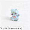 A small, light blue 3D resin cat keychain with pink accents and paw pads.