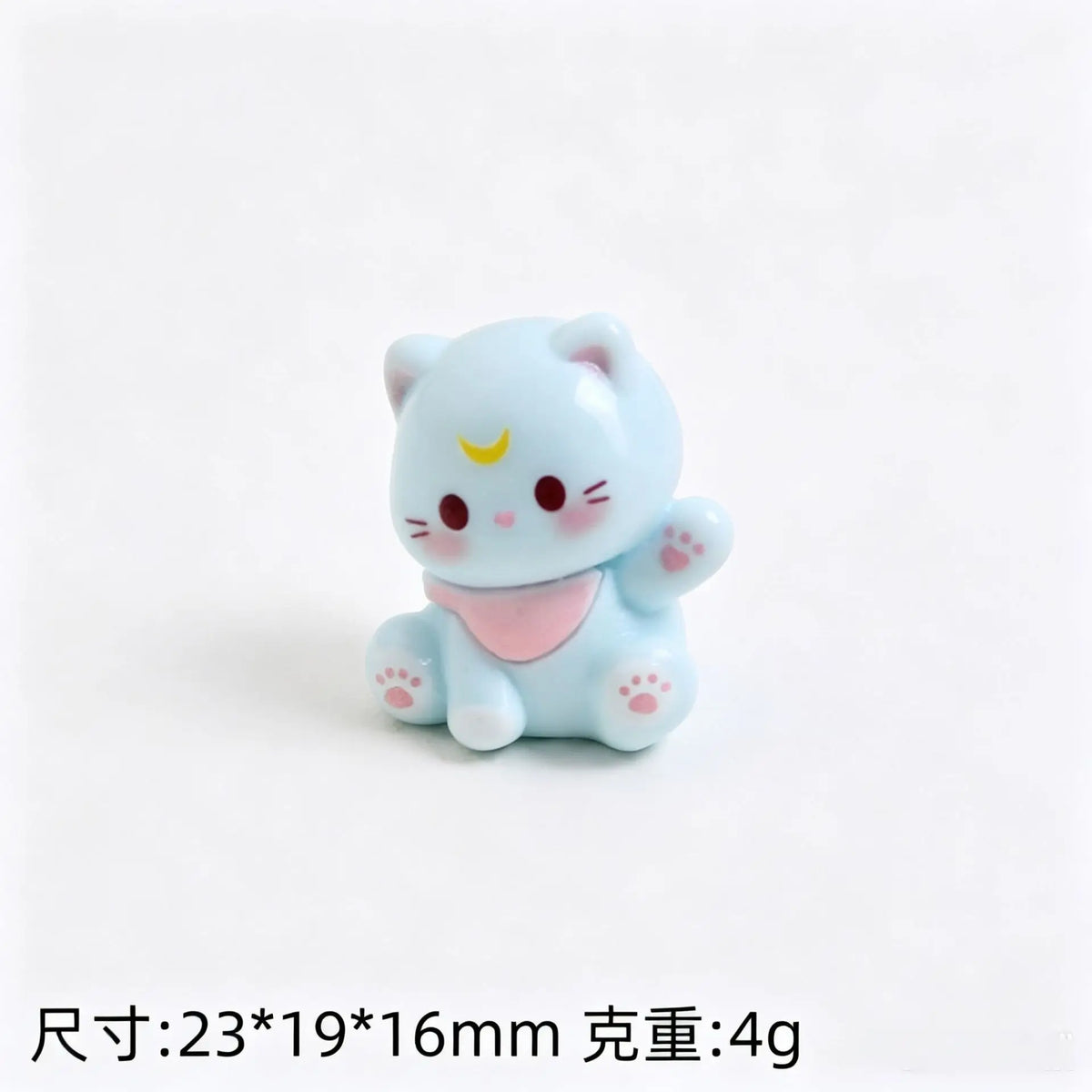 A small, light blue 3D resin cat keychain with pink accents and paw pads.