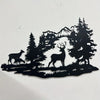 Black silhouette wall art depicting a deer standing in a dense forest with mountains in the background